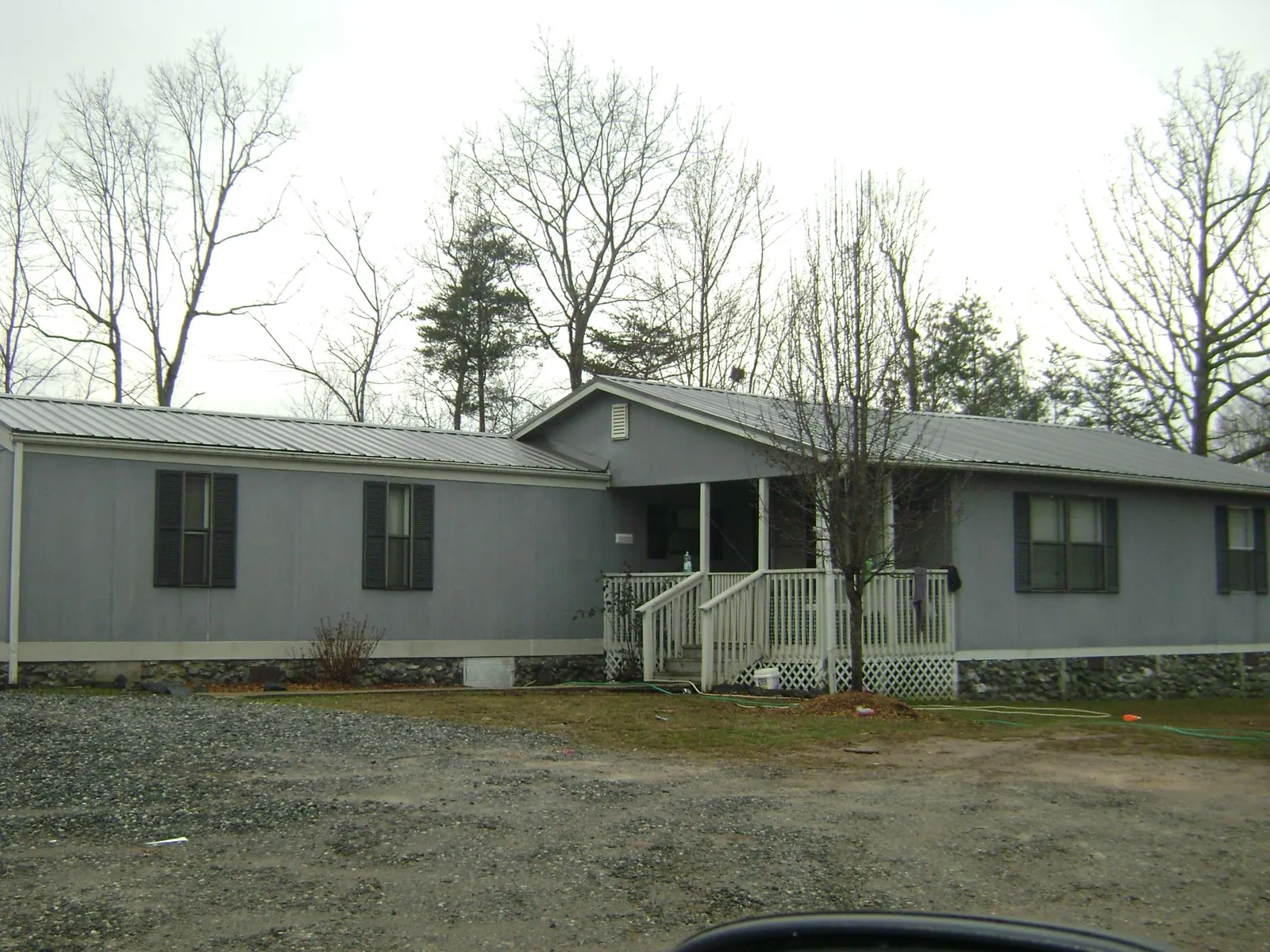 Metal roof over a manufactured home with a covered front porch in San Antonio